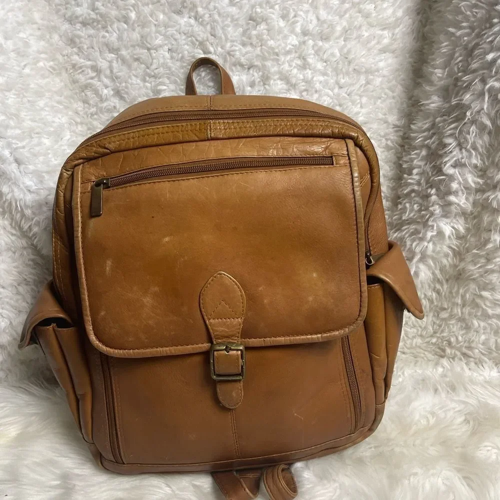 Unbranded tan leather large Backpack antique tone hardwares.